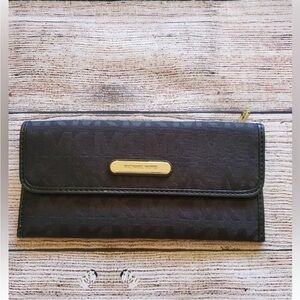 Michael Kors Monogram Black Wallet with Textured Leather and Flap Closure